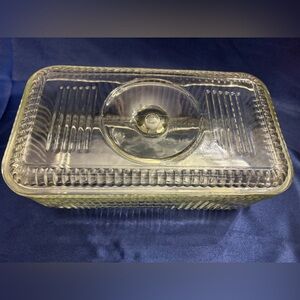 Vintage clear glass refrigerator storage dish with ribbed sides and lid.